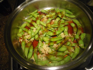 Teriyaki garlic glazed Edamame cooking in the pan.